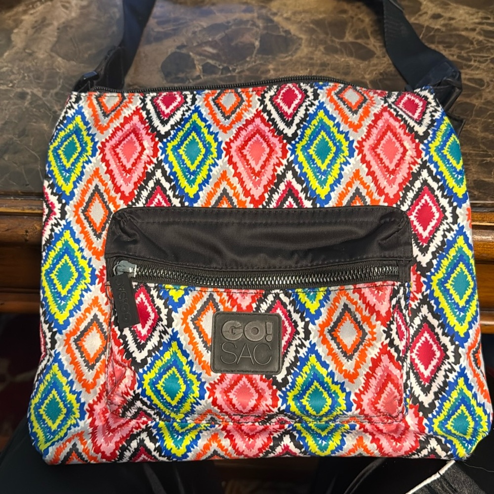 Go Sac black strap zippered compartment front red orange pink blue